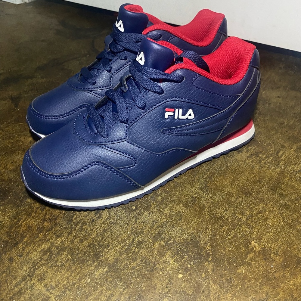 Red white and blue Fila sneakers.